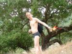 Tossing his visor in grey patagonia briefs