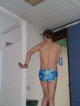 Dancing with joy in a new Speedo with tags still on.