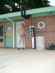 Talking on the phone in a speedo