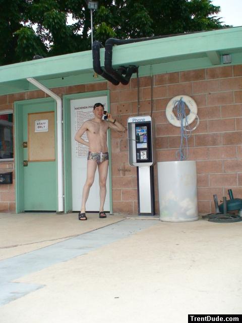Talking on the phone in a speedo