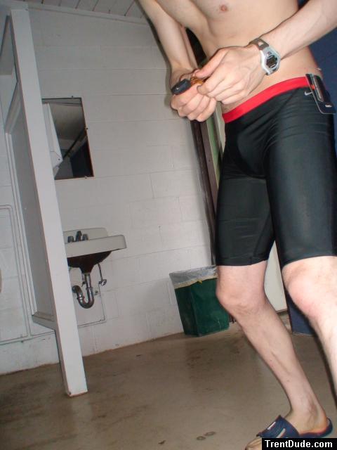 holding a remote - Nike Swim Men's Hydra Jammer from SwimOutlet.com