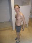 A hairy chest in grey boxer briefs, Nike slippers