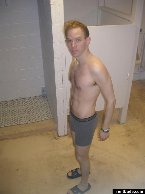 A hairy chest in grey boxer briefs, Nike slippers