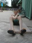 Crunches in a Nike swim jammer, toes in Nike slippers (pouch)