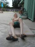 Crunches in a Nike swim jammer, toes in Nike slippers (pouch)