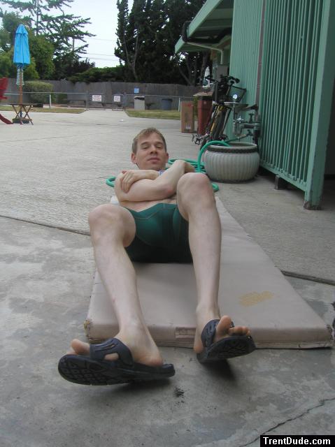 Crunches in a Nike swim jammer, toes in Nike slippers (pouch)