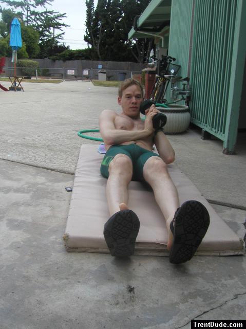 Using weights to make the crunches more difficult (pouch) (chest hair)