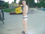 Swimmer with a white Speedo Engineered Stripe Square Cut suit, Tyr kick board (best)