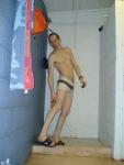 Reaching back to scrub his legs, white speedo square leg suit