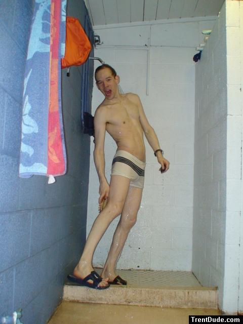 Reaching back to scrub his legs, white speedo square leg suit