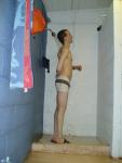 Scrubbing his back in the white jammer
