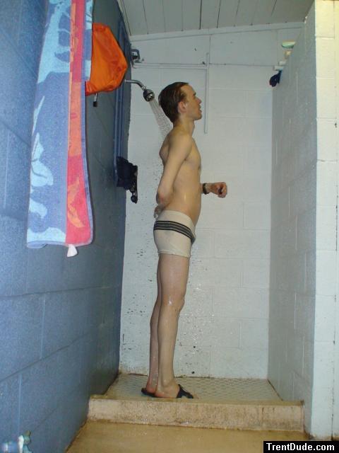 Scrubbing his back in the white jammer