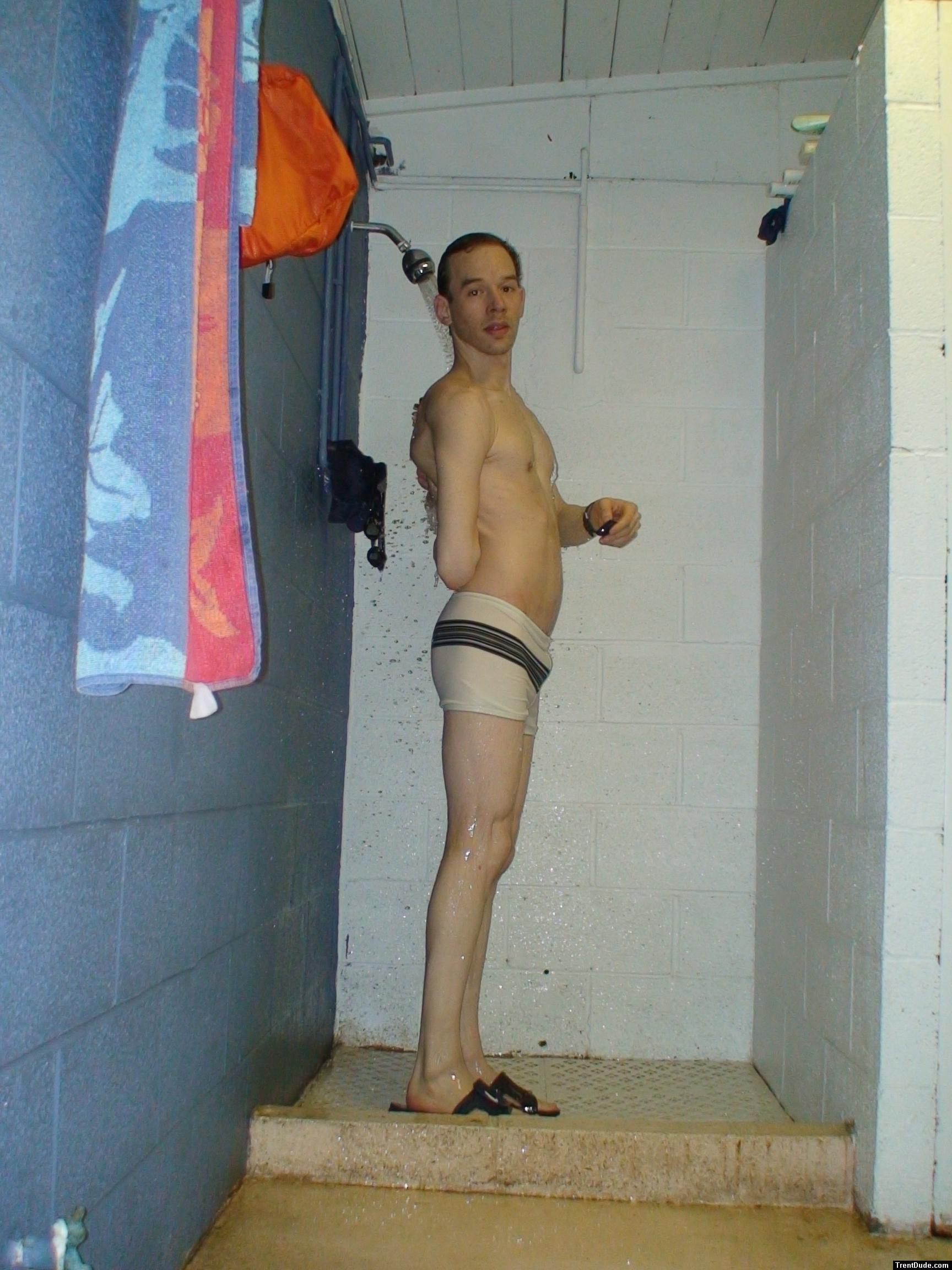 Scrubbing his back in the shower
