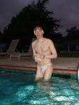On a cold morning at the pool in a white Speedo