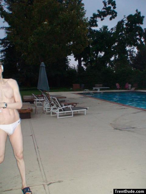 Embarrased to have his whole body seen in a white Speedo