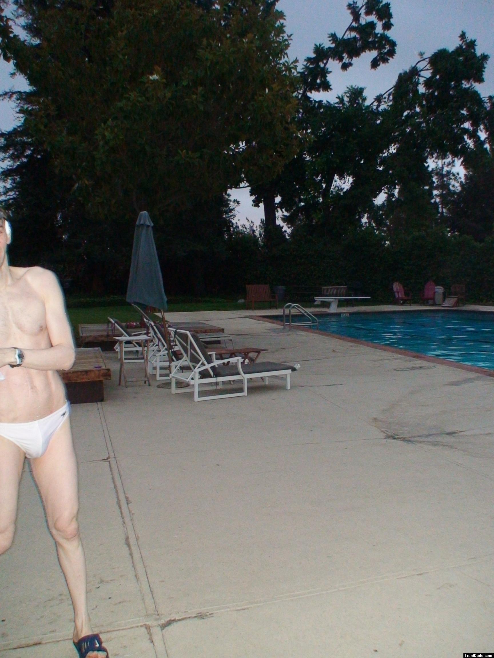 Embarrased to have his whole body seen in a white Speedo