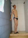 Embarrased to wear a white speedo, so he puts a blue speedo on top