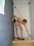 Grabbing for the soap dish in his white speedo
