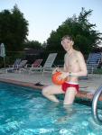 About to play water polo in a red speedo with a black Speedo underneath