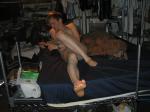 dude laying on bed in his underwear wearing a grey Tommy Hilfiger brief  (this is accompanied by a video)