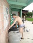 putting out the trash in a Pirates swimsuit by designer Ami Sanzuri