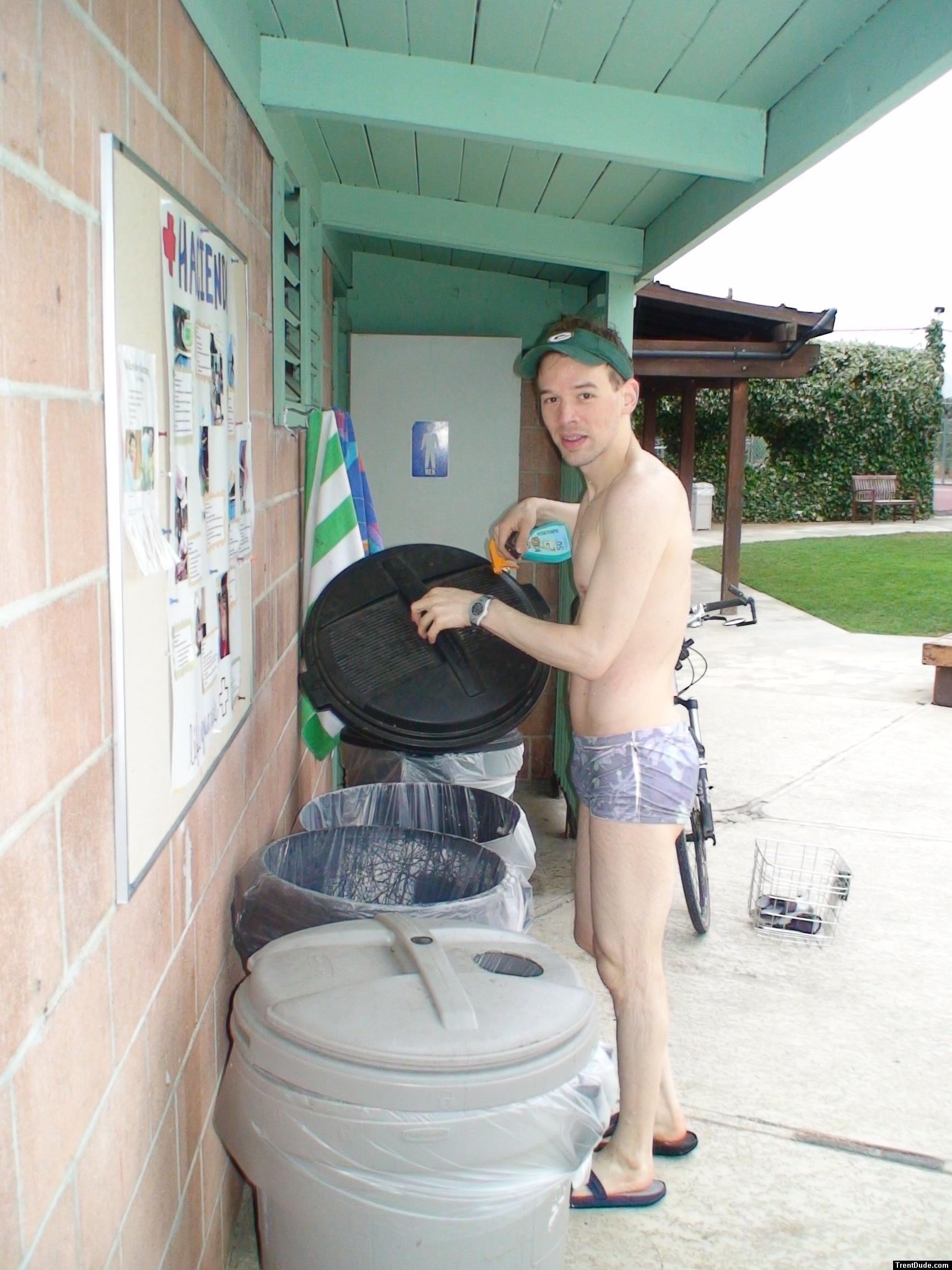 putting out the trash in a Pirates swimsuit by designer Ami Sanzuri