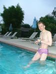 wearing a Ami Sanzuri Swimwear Square Cut Trunk (MCMX Purple Size Medium)