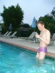 wearing a Ami Sanzuri Swimwear Square Cut Trunk (MCMX Purple Size Medium)