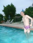 wearing a Ami Sanzuri Swimwear Square Cut Trunk (MCMX Purple Size Medium)