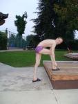 stretching in a Ami Sanzuri Swimwear Square Cut Trunk (MCMX Purple Size Medium)