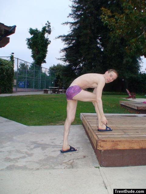 stretching in a Ami Sanzuri Swimwear Square Cut Trunk (MCMX Purple Size Medium)