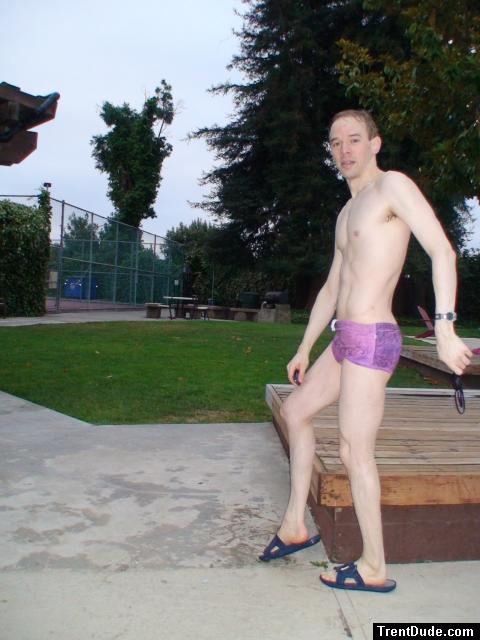 stretching in a Ami Sanzuri Swimwear Square Cut Trunk (MCMX Purple Size Medium)