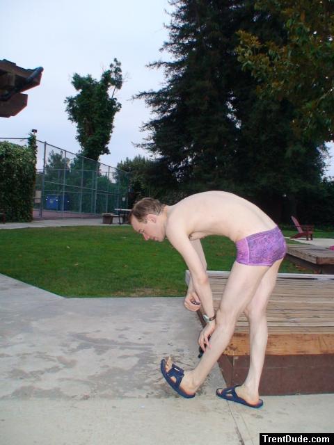 stretching in a Ami Sanzuri Swimwear Square Cut Trunk (MCMX Purple Size Medium)