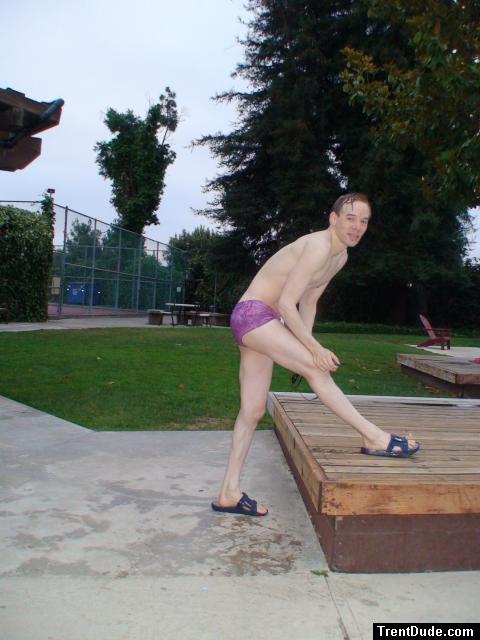 stretching in a Ami Sanzuri Swimwear Square Cut Trunk (MCMX Purple Size Medium)