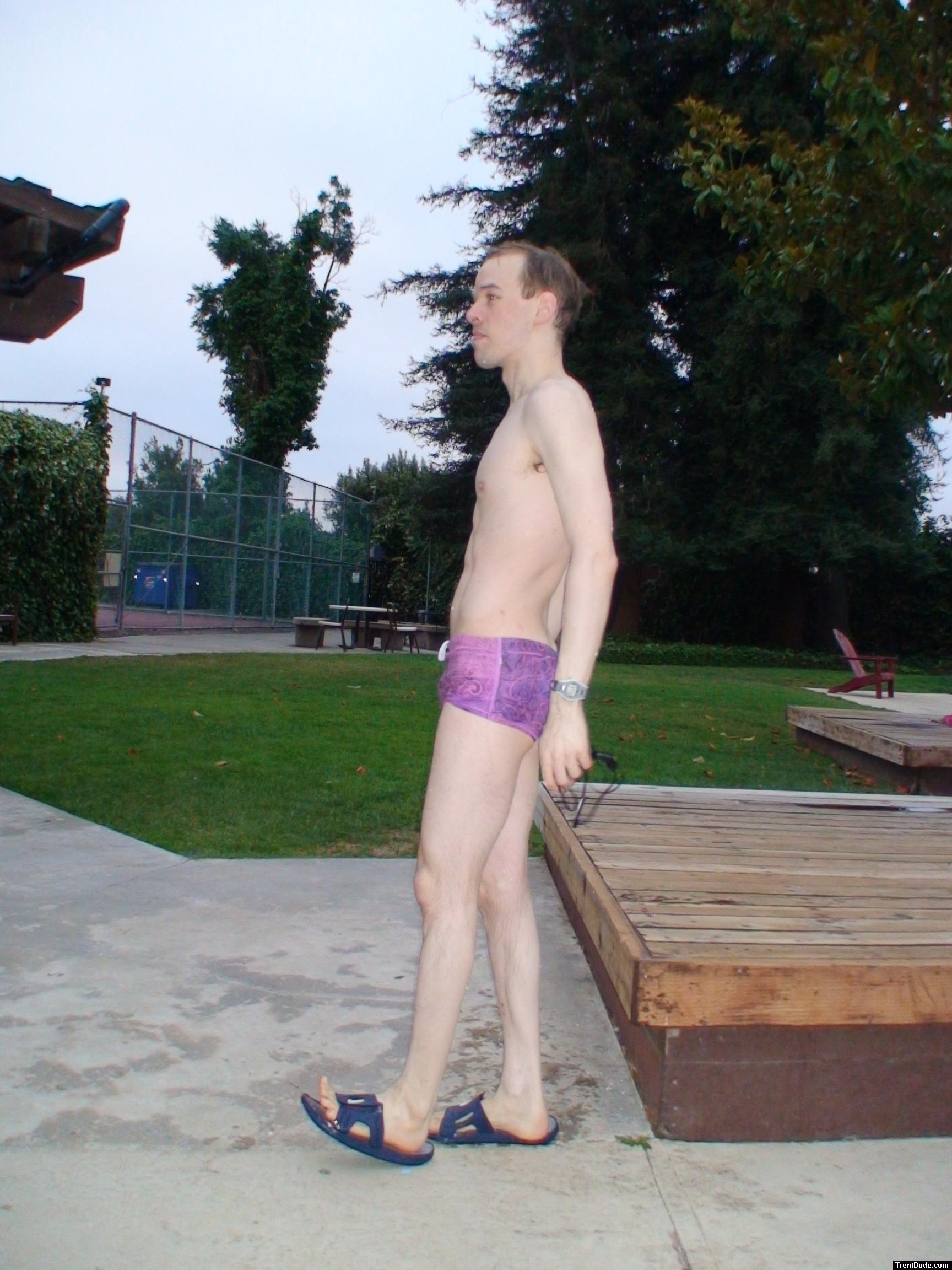 standing in a Ami Sanzuri Swimwear Square Cut Trunk (MCMX Purple Size Medium)