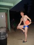 Swimmer in a sapphire solar speedo from macys.com, with basketball