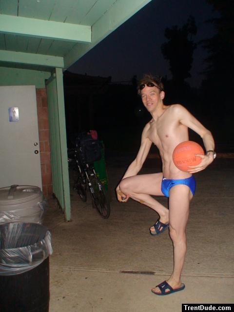 Swimmer in a sapphire solar speedo from macys.com, with basketball