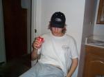 Posing with a soda can
