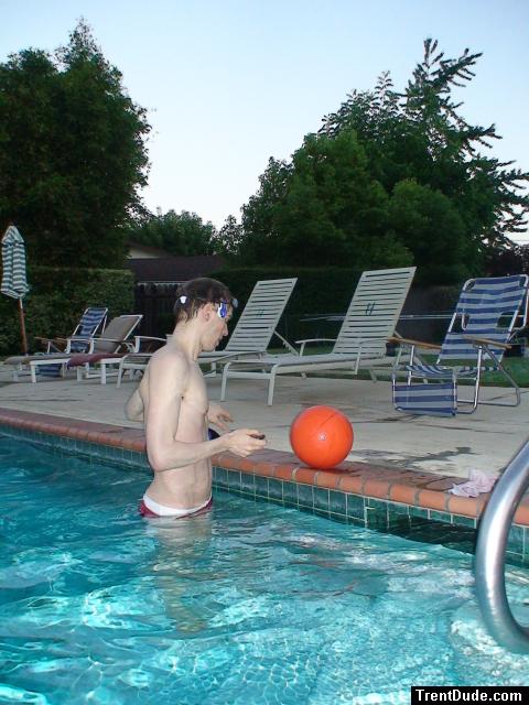 in the pool wearing a red speedo