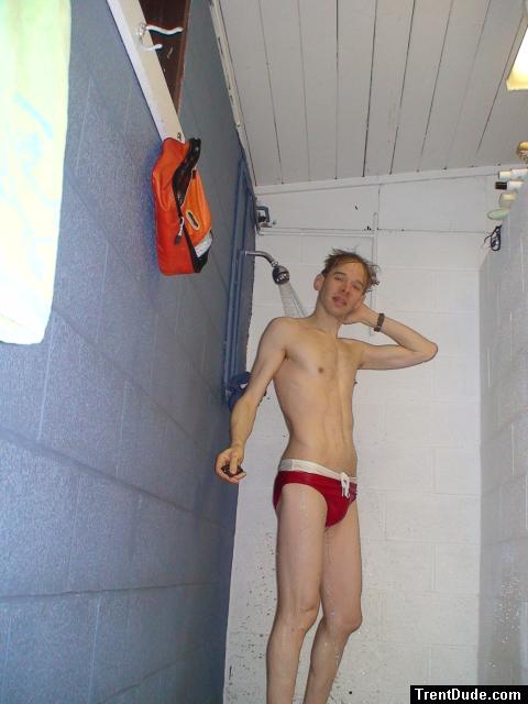 Showering in a red Speedo