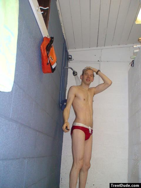 Showering in a red Speedo