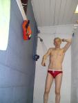Showering in a red Speedo
