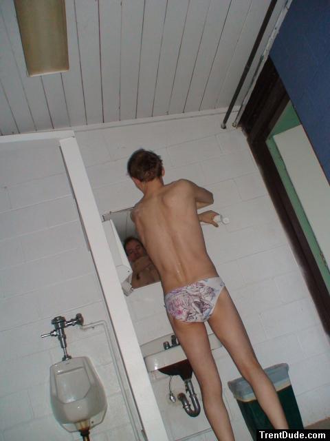 back side of the Love Letter swim brief (applying swim lotion to back)