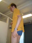 dude wearing a Blue Patagonia brief in the swim locker room (rear)