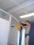 Blue Patagonia brief in the swim locker room, and yellow t-shirt (best)