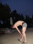 Reaching down in a Calvin Klein swim boxer
