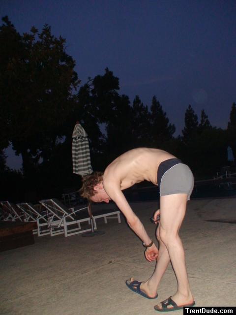 Reaching down in a Calvin Klein swim boxer