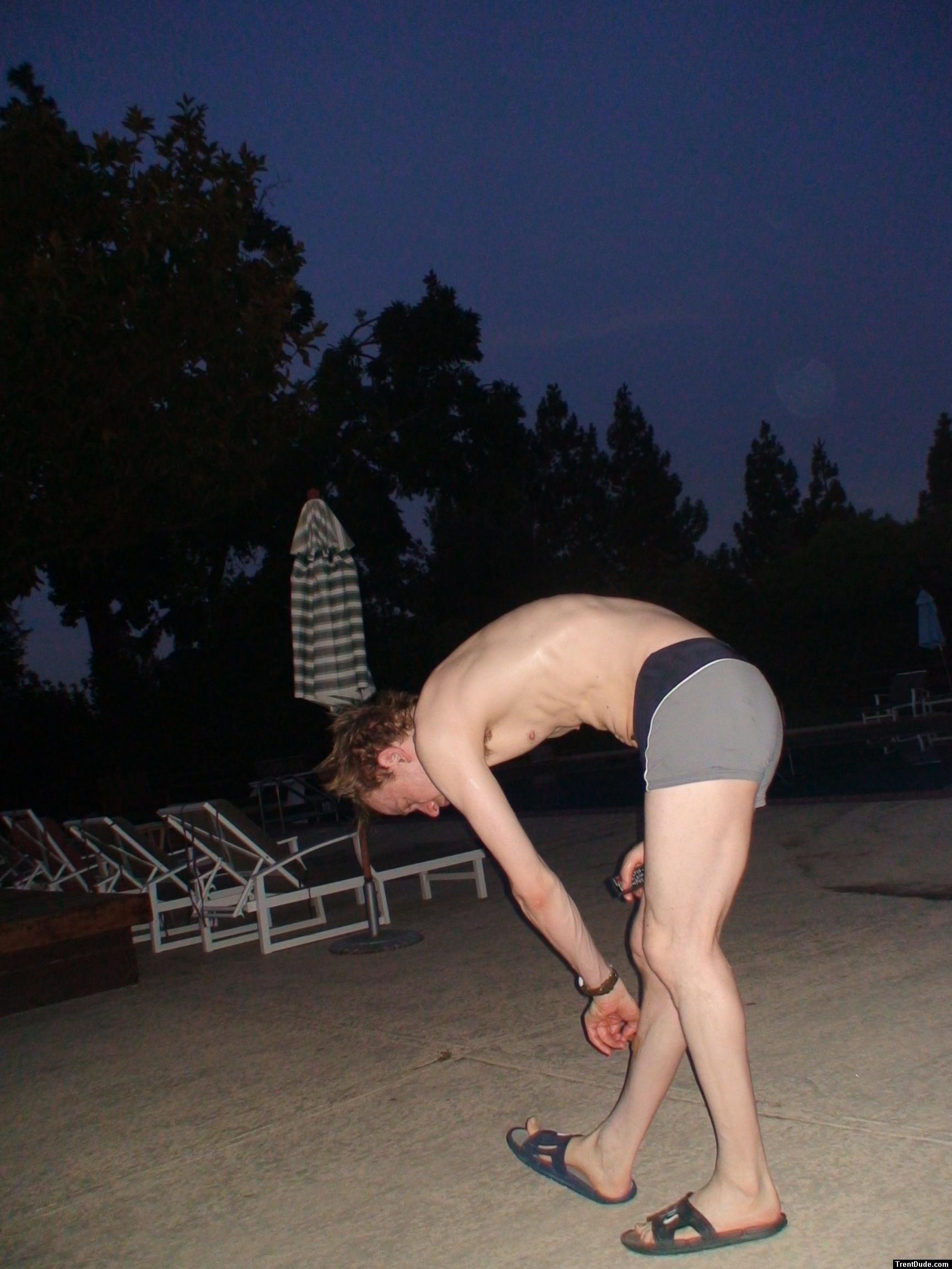 Reaching down in a Calvin Klein swim boxer