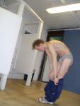 Undressing to  grey Tommy Hilfiger briefs in the locker room