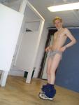 Wearing grey Tommy Hilfiger briefs in the locker room, Adidas sweats at his ankles
